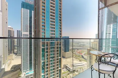a balcony with a view of a city at Marina Gate 1, Dubai Marina - Chic One Bedroom in Dubai