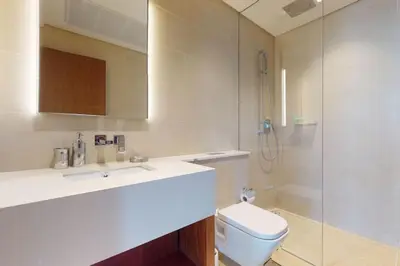 a bathroom with a sink and a toilet and a shower at Marina Gate 1, Dubai Marina - Chic One Bedroom in Dubai