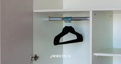 a door with a sock hanging on it at Stylish Studio - Panoramic Pool View - JVC in Dubai