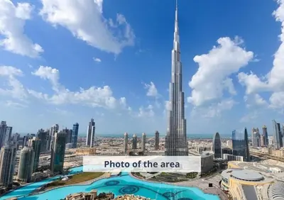 a view of the burj khalifa and the photo of the area at Suitestay Address Dubai Mall Residence in Dubai