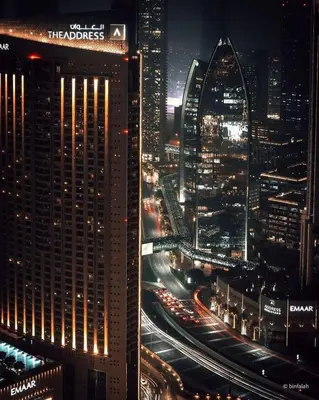 a view of a city at night with traffic at Suitestay Address Dubai Mall Residence in Dubai