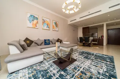 a living room with a couch and a table at Amazing BeachFront Apartments near Atlantis Waterpark by Simply Comfort Sarai Palm Jumeirah in Dubai