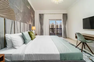 a bedroom with a large bed and a television at Amazing BeachFront Apartments near Atlantis Waterpark by Simply Comfort Sarai Palm Jumeirah in Dubai