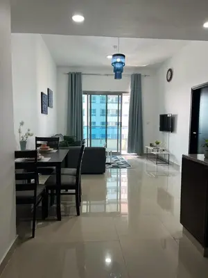 a living room with a table and a couch at Elegant stay at marina Dubai in Dubai