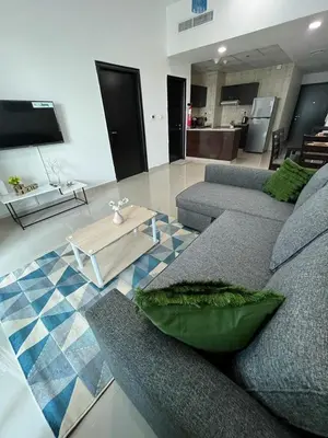 a living room with a couch and a table at Elegant stay at marina Dubai in Dubai