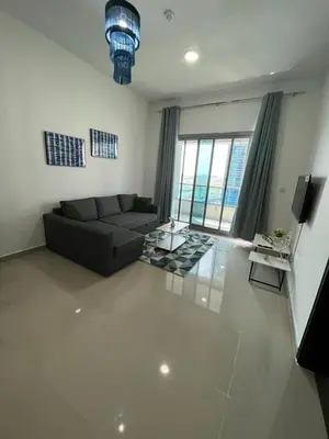 a living room with a couch and a table at Elegant stay at marina Dubai in Dubai
