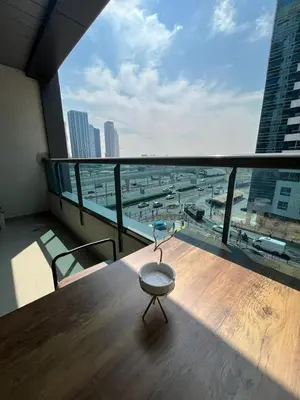 a table on a balcony with a view of a city at Elegant stay at marina Dubai in Dubai