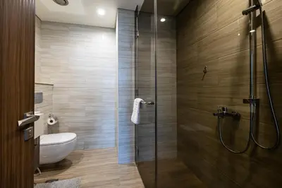 a bathroom with a shower and a toilet at MBL I Modern 2 Bedroom Apartment in JLT in Dubai