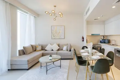 a living room with a couch and a table at Elegant 2 Bedroom Luxury Living in Harbour Gate - Allsopp&Allsopp in Dubai