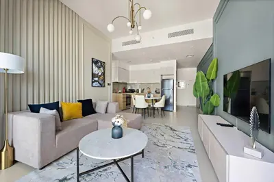 a living room with a couch and a table at Silkhaus Burj Royale 1BDR with balcony in Downtown in Dubai