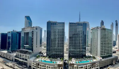 an aerial view of a city with tall buildings at Athesa Apartments Downtown Dubai Business Bay in Dubai