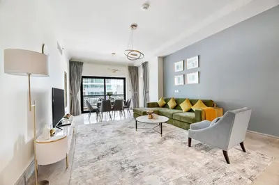 a living room with a couch and a table at StoneTree - Fairmont North 2 BR - Beach Access in Dubai