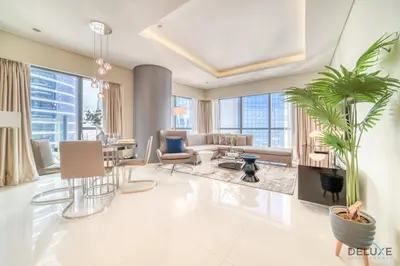 a living room with a couch and a table at Sophisticated 2BR at DAMAC Towers by Paramount A Business Bay by Deluxe Holiday Homes in Dubai