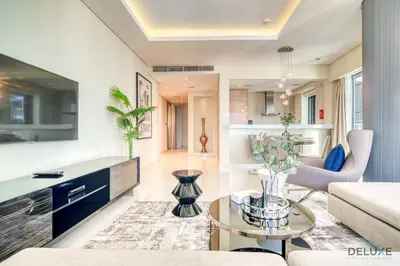 a living room with a couch and a table at Sophisticated 2BR at DAMAC Towers by Paramount A Business Bay by Deluxe Holiday Homes in Dubai