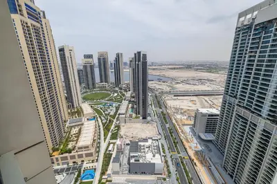 an aerial view of a city with tall buildings at Creek View Apartment in Creek Harbour in Dubai
