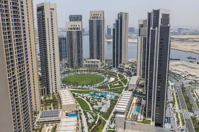 an aerial view of a city with tall buildings at Creek View Apartment in Creek Harbour in Dubai