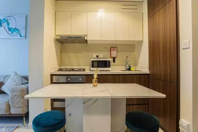 a kitchen with a counter top and a microwave at TURQUOISE - Downtown Dubai 1 BEDROOM APARTMENT Business Bay - CANAL VIEW in Dubai