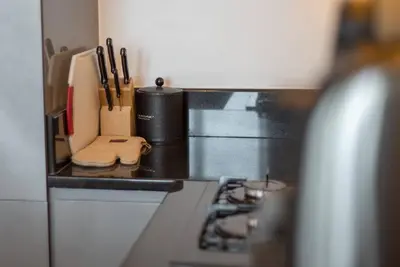 a kitchen with a counter top with a stove at Upscale 1 bed apartment in Business Bay-Suiteable in Dubai
