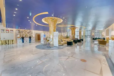a lobby with a large room with a large gold object at Upscale 1 bed apartment in Business Bay-Suiteable in Dubai
