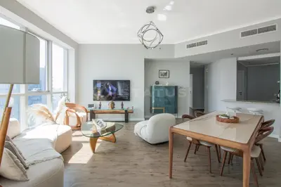 a living room with a couch and a table at Birds Eye 2BR - Torch Tower-L51 - Near Marina Walk in Dubai