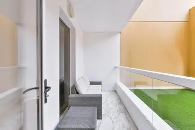 a staircase in a house with a green floor at Stunning 1BR in Bahar near JBR Beach in Dubai