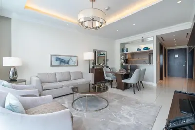 a living room with a couch and a table at New Listing - Serviced Apartment & TOP Amenities in Dubai