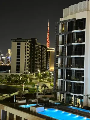 a view of a city at night with tall buildings at Modern Studio Center of Dubai in Dubai